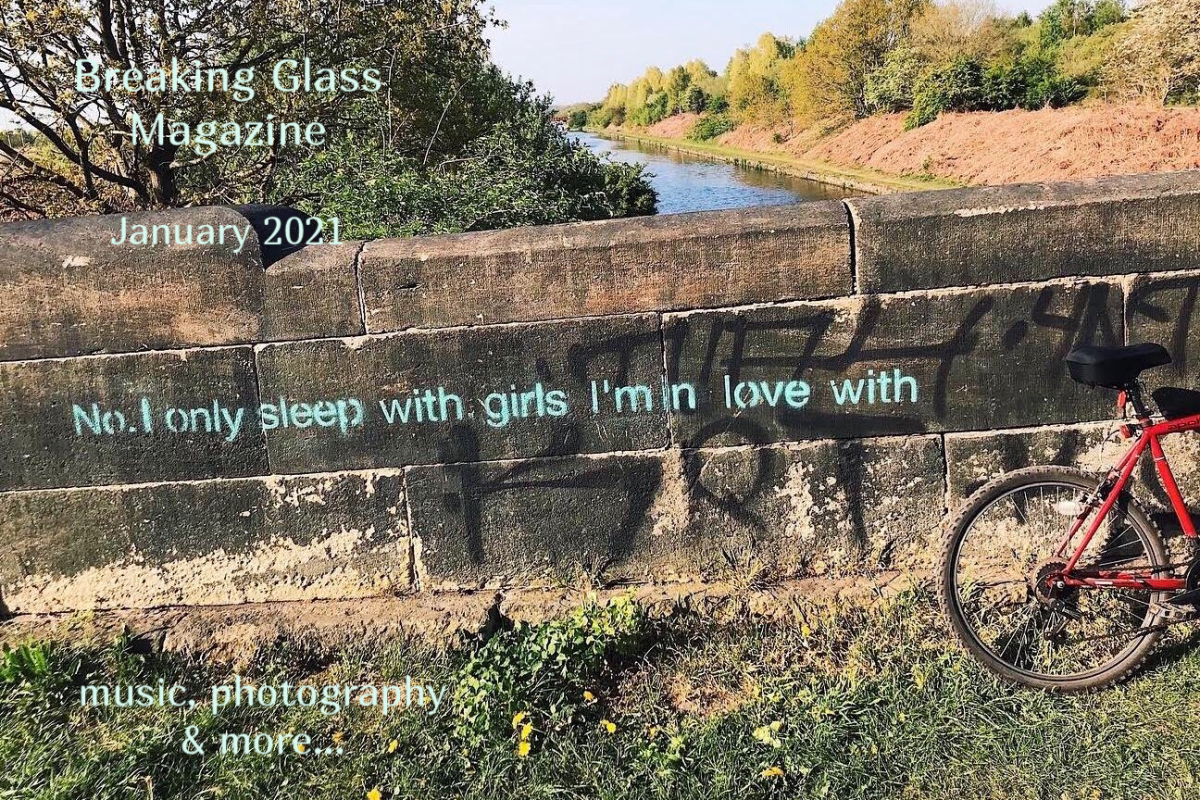 A stone bridge over a river with this slogan stencilled on in light blue paint ‘No. I only sleep with girls I’m in love with’.